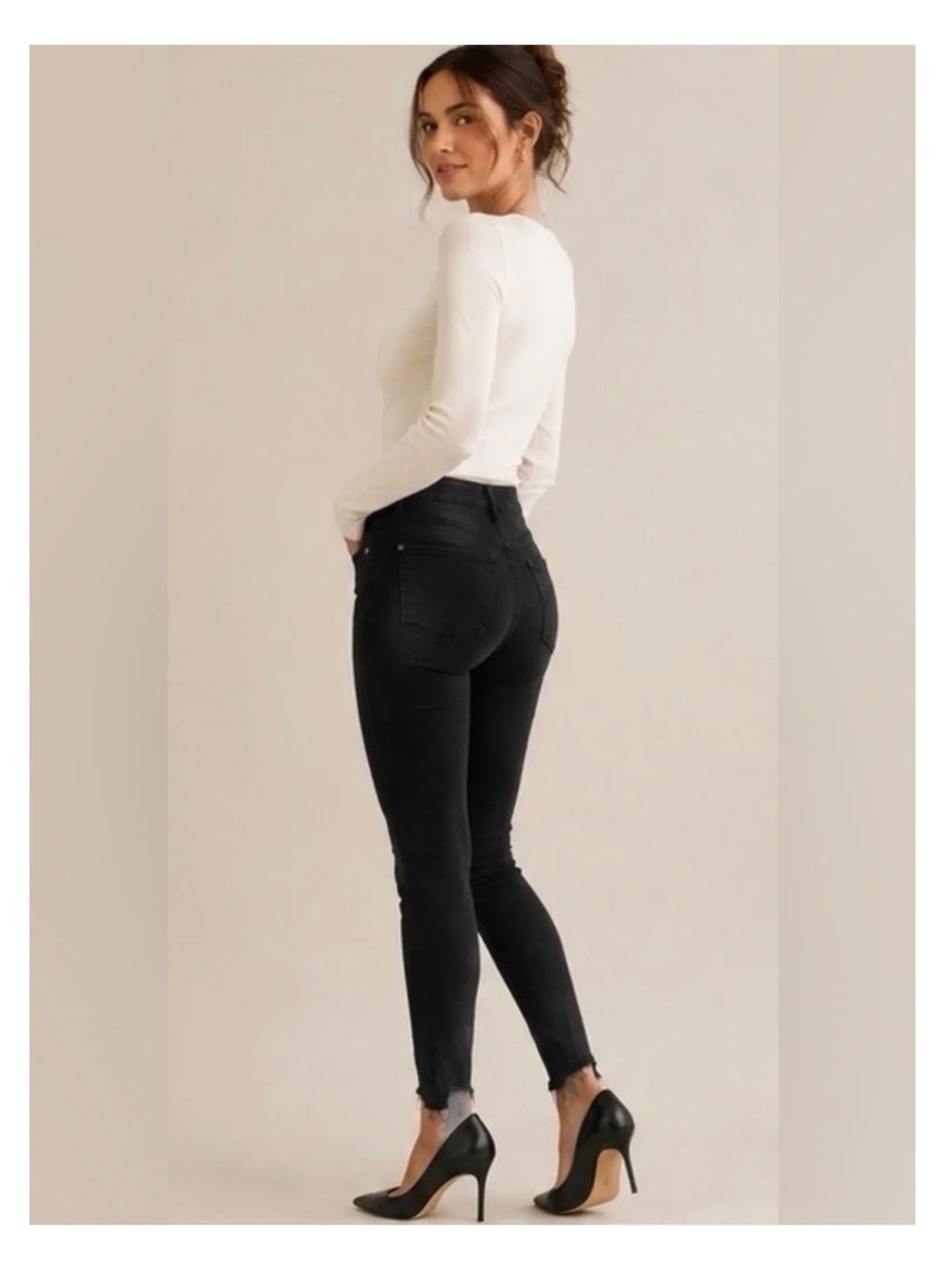 PAIGE Hoxton Ankle skinny jeans in a versatile black wash with edgy raw hems